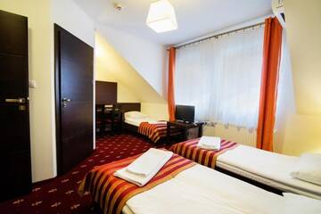 Фото номера Трехместный номер Отель Hotel Jagiełło г. Хрубешув 8